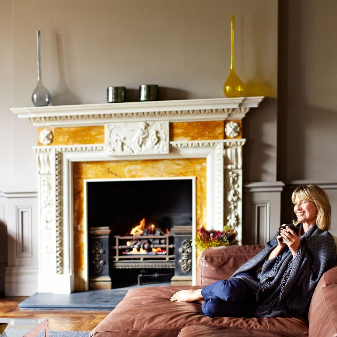 woman staying warm and comfortable in her home