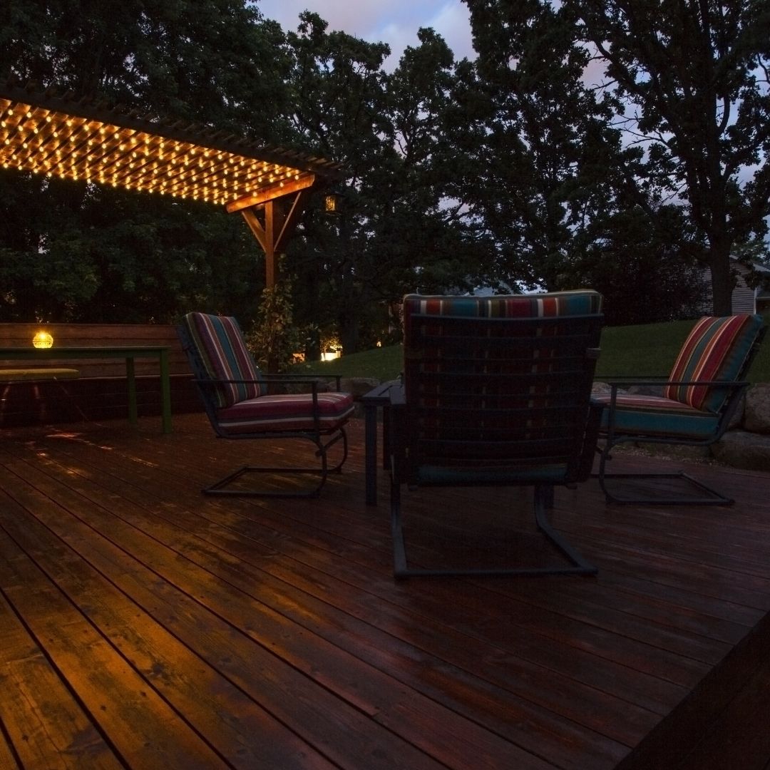 backyard patio with chairs and a pergola